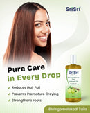 Sri Sri Tattva hair care product with a woman showing off her hair on a light green background