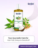 Sri Sri Ayurved Brahmi Bhringraj Taila bottle with coconut, leaves, and flowers on a light purple background