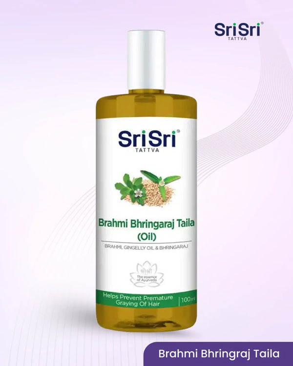 Sri Sri Tattva Brahmi Bhringraj Taila oil bottle on a light purple background