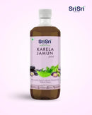 Bottle of Sri Sri Karela Jamun juice on a white background