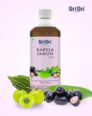 Sri Sri Karela Jamun juice bottle with fruits on a white background