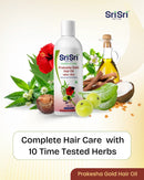 Sri Sri Prakesha Gold Hair Oil bottle with herbs and natural elements on a light background