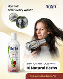 Sri Sri Prakesha Gold Hair Oil advertisement with a woman using a hair dryer and text about hair care.