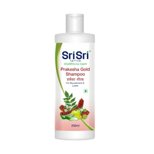 A bottle of Sri Sri Tattva Prakesha Gold Shampoo with a label showing the brand name and an illustration of herbs.