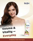 Woman with long brown hair next to Sri Sri Prakesha Gold Shampoo bottle on a beige background