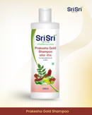 Sri Sri Prakesha Gold Shampoo bottle on a gradient background