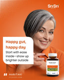 Smiling person starting the day — happy gut, happy day with gentle regularity support from Haritaki