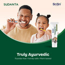 Father and daughter brushing teeth with Sudanta toothpaste, featuring Sri Sri Tattva Sudanta Fluoride free truly ayurvedic toothpaste.
