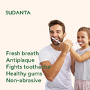 Man and young girl brushing teeth together with Sudanta toothpaste